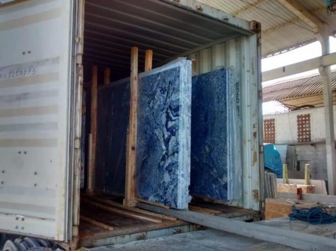 Blue Bahia blue marble slabs inside a container ready for shipping.